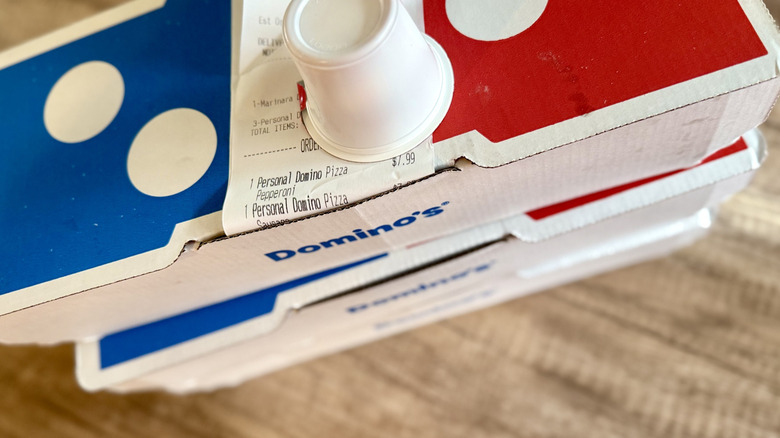 Stack of Domino's takeout boxes