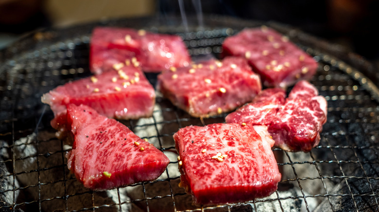 Kobe beef cooking on a grill