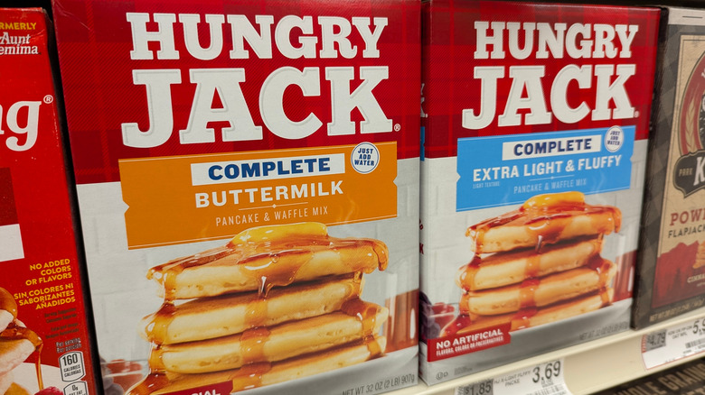 Two boxes of pancake mix on store shelf