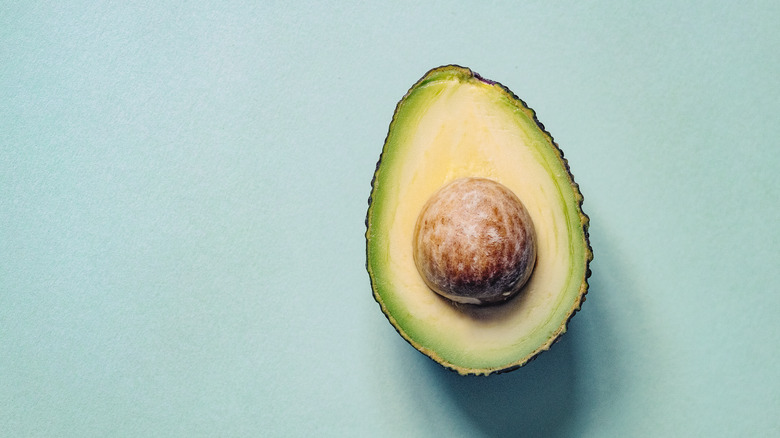 Avocado pit inside an avocado