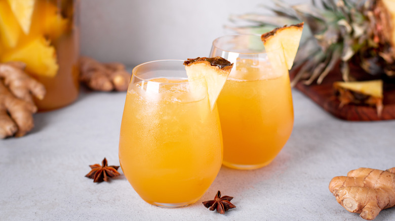 glasses of tepache garnished with pineapple
