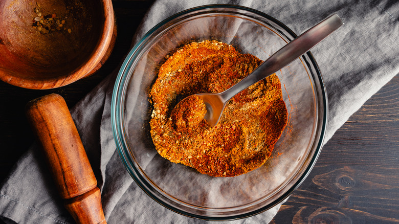 A homemade spice blend in a glass mixing bowl