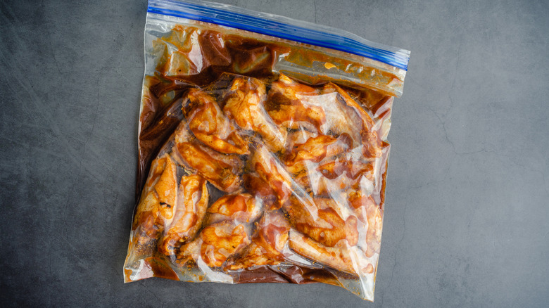 chicken wings marinating in bag