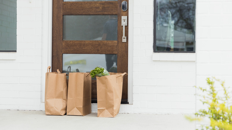 An image of food delivery at a door.