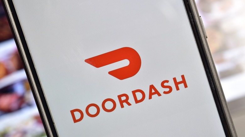 DoorDash logo on phone screen