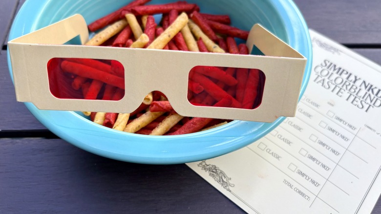 A mixed bowl of regular and NKD Doritos Dinamita as seen through color-neutralizing glasses