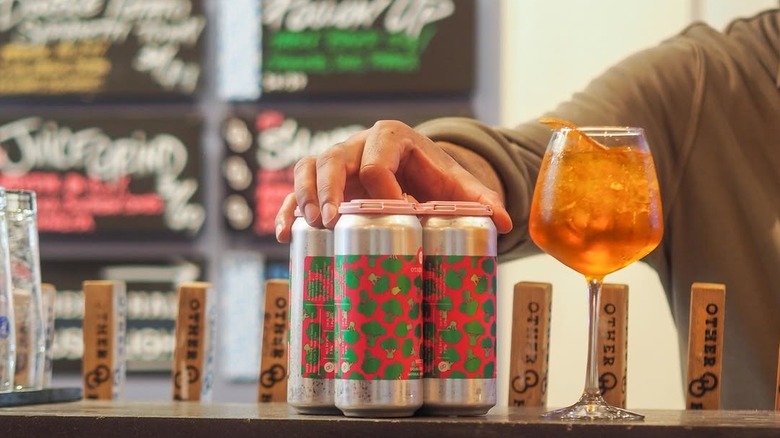 Other Half Brewing cans and glass