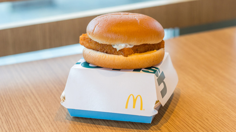 A Filet-O-Fish sandwich from McDonald's on top of its white and blue box