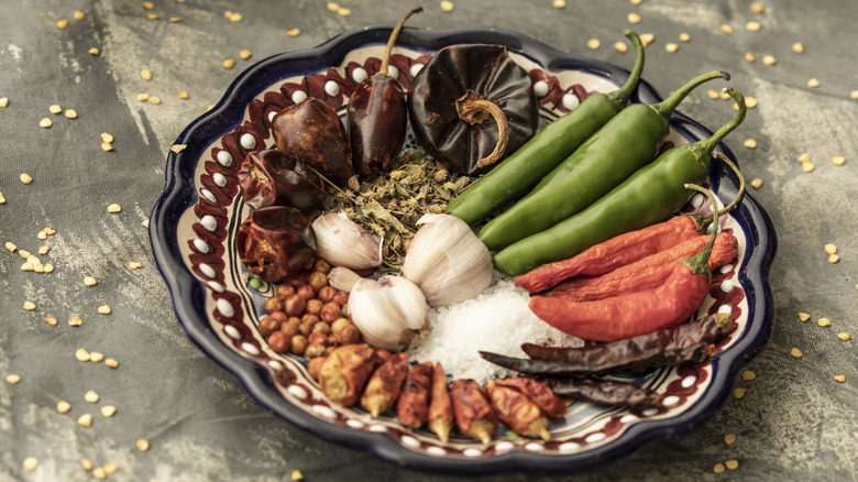 Mexican spices, peppers, and ingredients on a plate