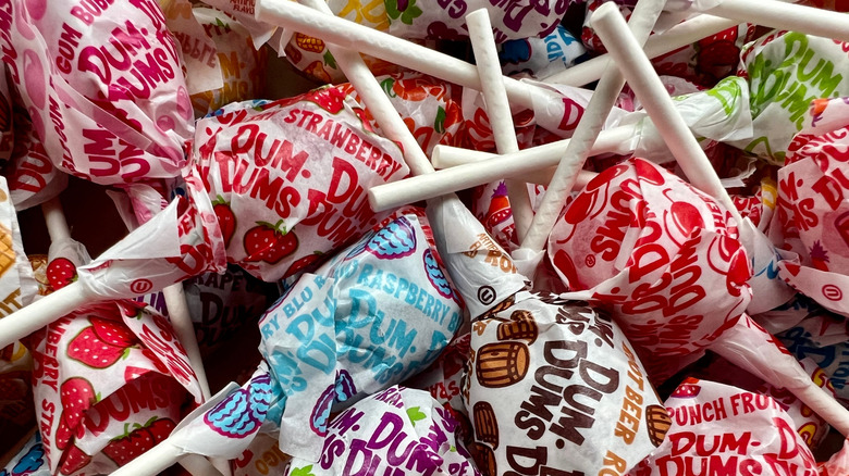 A pile of various Dum Dum lollipops