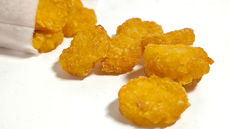Crispy mini hash browns on white background
