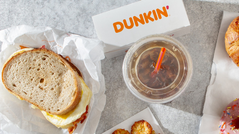 Dunkin' sandwich next to coffee