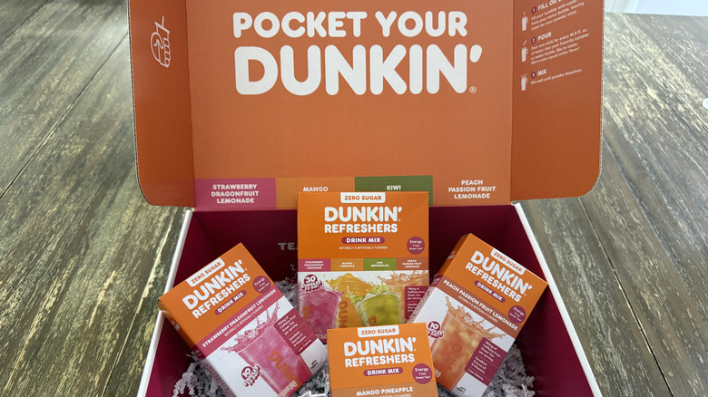 Four boxes of Dunkin' Refreshers in a large Dunkin' box