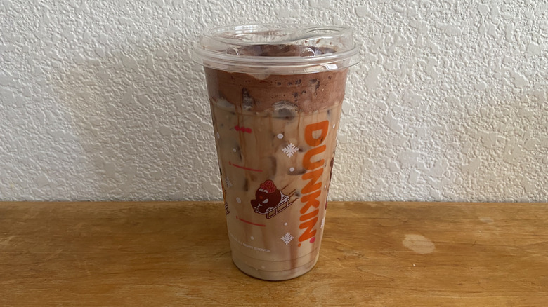 Cocoa Cloud Latte on wooden table.