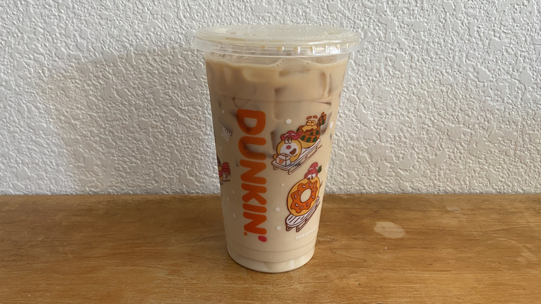 Iced Protein Latte with Sugar-Free Vanilla on wooden table.