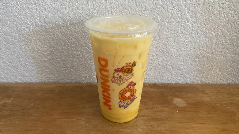 Megan's Mango Protein Refresher on wooden table.