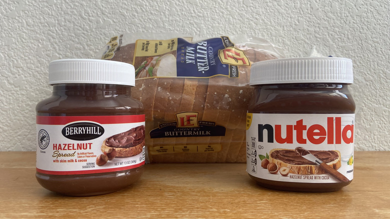 Aldi and Nutella jars in front of a loaf of bread