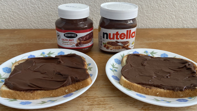both bread slices with spread in front of their respective jars
