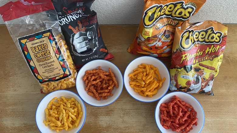 top-down view of all four snacks in bowls in front of their respective bags