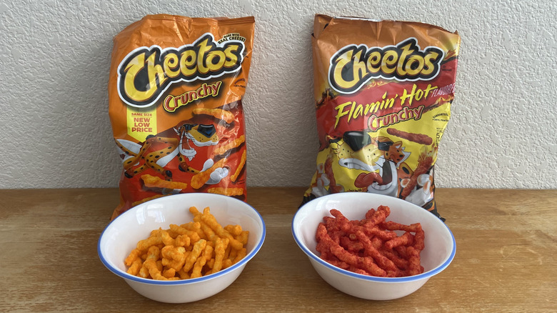 Bowls of both Cheetos in front of their respective bags