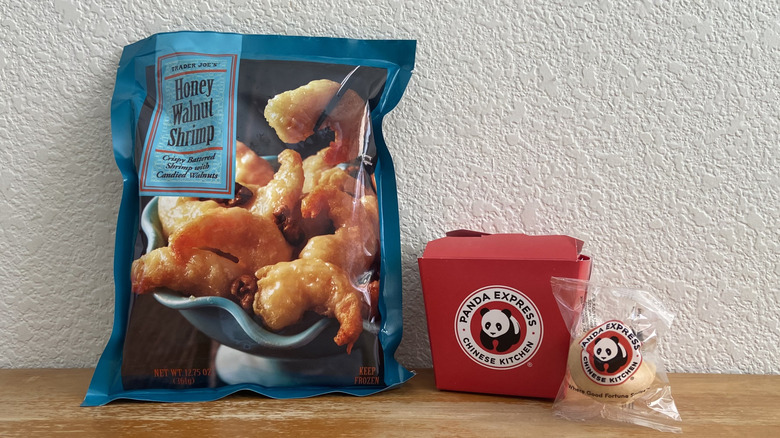 unopened Trader Joe's shrimp bag beside closed Panda Express container and fortune cookie