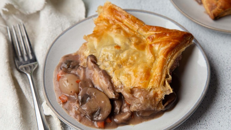 Slice of mushroom pot pie on plate