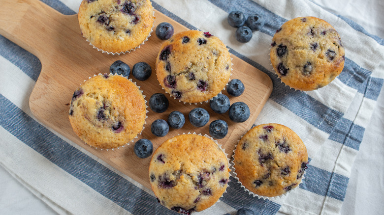 blueberry muffins on wooden board