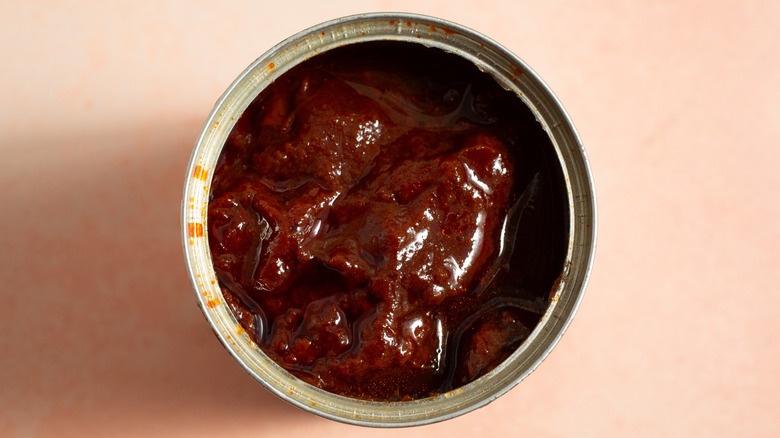 Top view of open can of chipotles in adobo