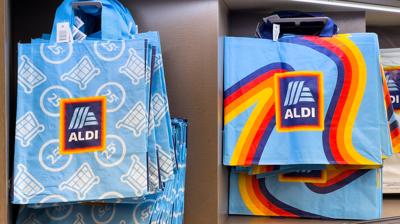 Two styles of blue aldi grocery bags