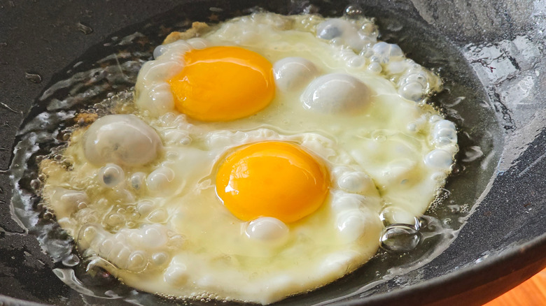 eggs frying in oil