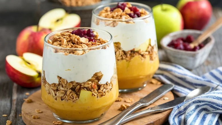Layered yogurt and fruit parfaits topped with granola cereal