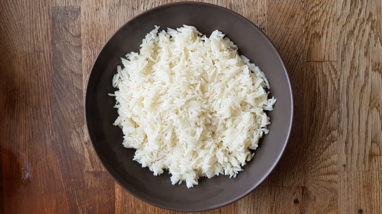 Plain cooked white rice in a black bowl