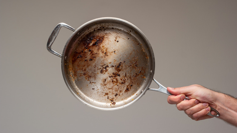 A dirty stainless steel pan.