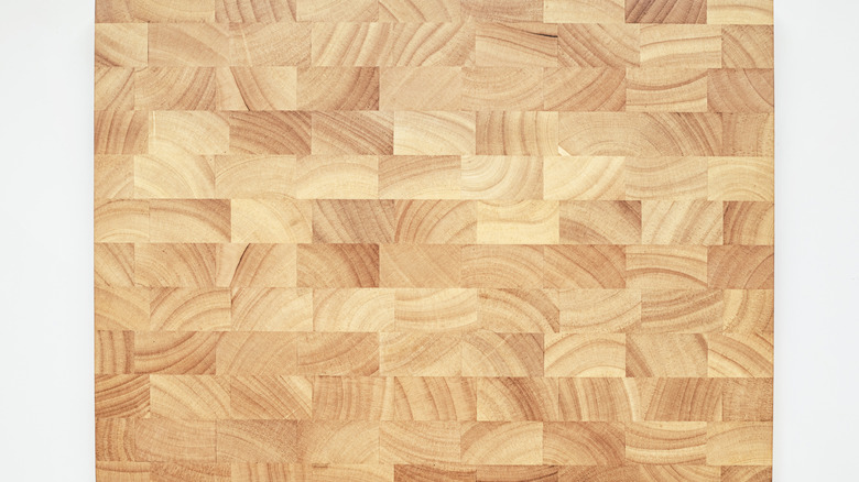 An end-grain cutting board on a white background.