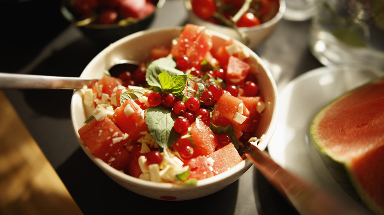 A watermelon and berry fruit salad in a bowl