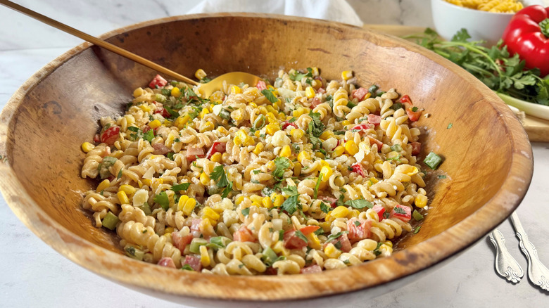 Elote corn pasta salad in wooden bowl