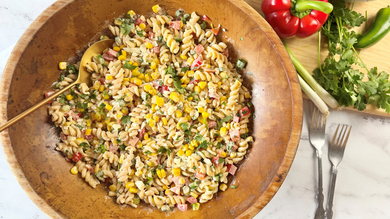 Elote pasta salad in wooden bowl