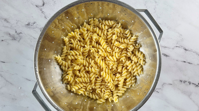 Fusilli pasta in colander