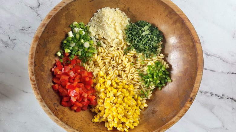 Unmixed elote pasta salad in bowl