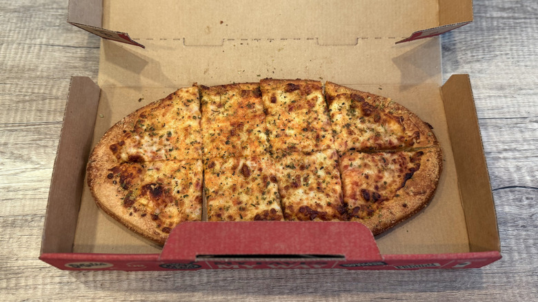 Pizza Hut's Crafted Flatzz cheese in box