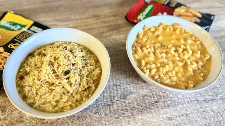 Two bowls filled with Knorr Hot Ones Mexican Rice and Cheesy Cheddar Pasta