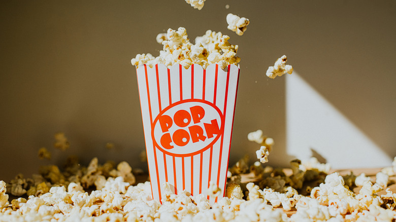 Red striped container of movie theater popcorn