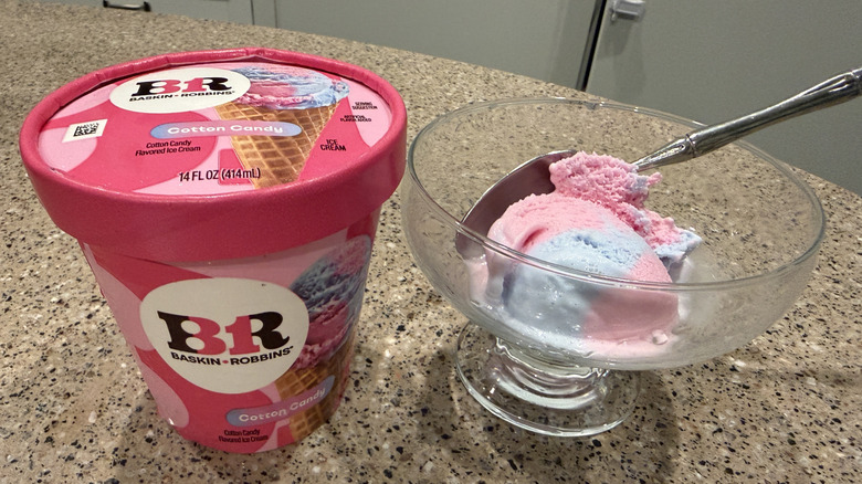 Baskin Robbins pint of Cotton Candy with a scoop in a glass bowl with a spoon