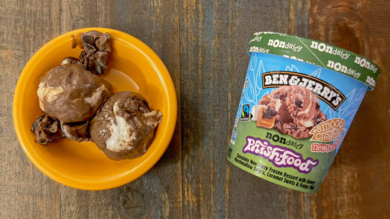 Two scoops of Ben & Jerry's Phish Food non-dairy ice cream next to a pint