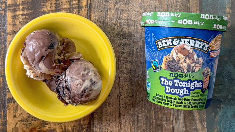 Two scoops of Ben & Jerry's The Tonight Dough non-dairy ice cream next to a pint