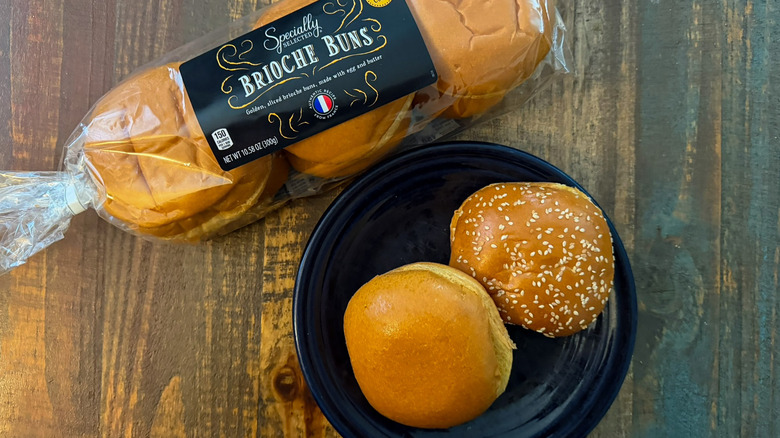 Aldi Specially Selected Brioche Buns in the packaging next to two buns on a plate