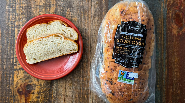 Aldi Specially Selected Everything Sourdough in its packaging next to two slices on a plate