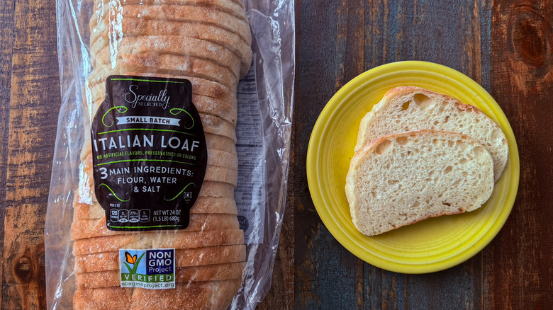 Aldi Specially Selected Italian Loaf in its packaging next to a plate of two slices