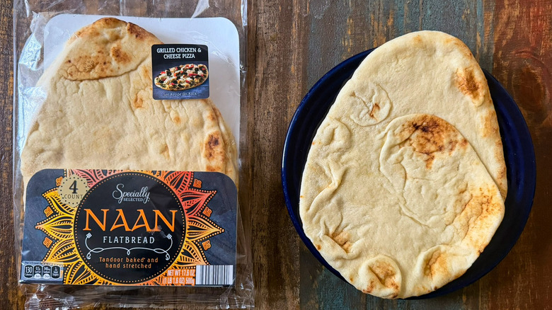 Aldi Specially Selected Naan Flatbread in its packaging next to a plate with a naan bread on it
