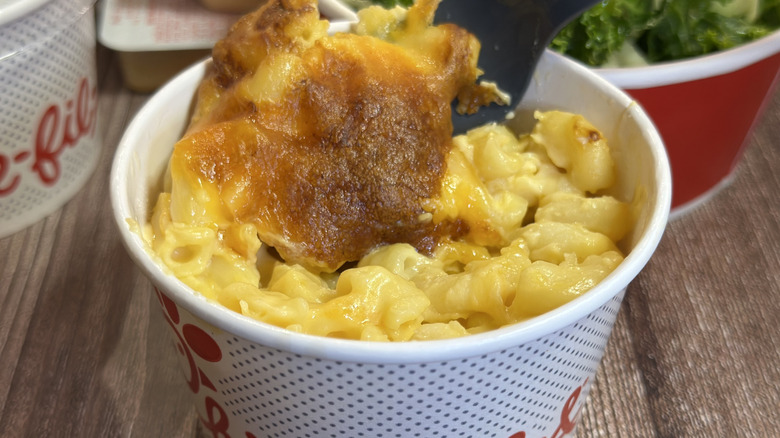Cup of Chick-fil-A Mac & Cheese with a plastic fork in it